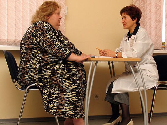 In the consultation of a phlebologist, a patient with varicose veins caused by obesity